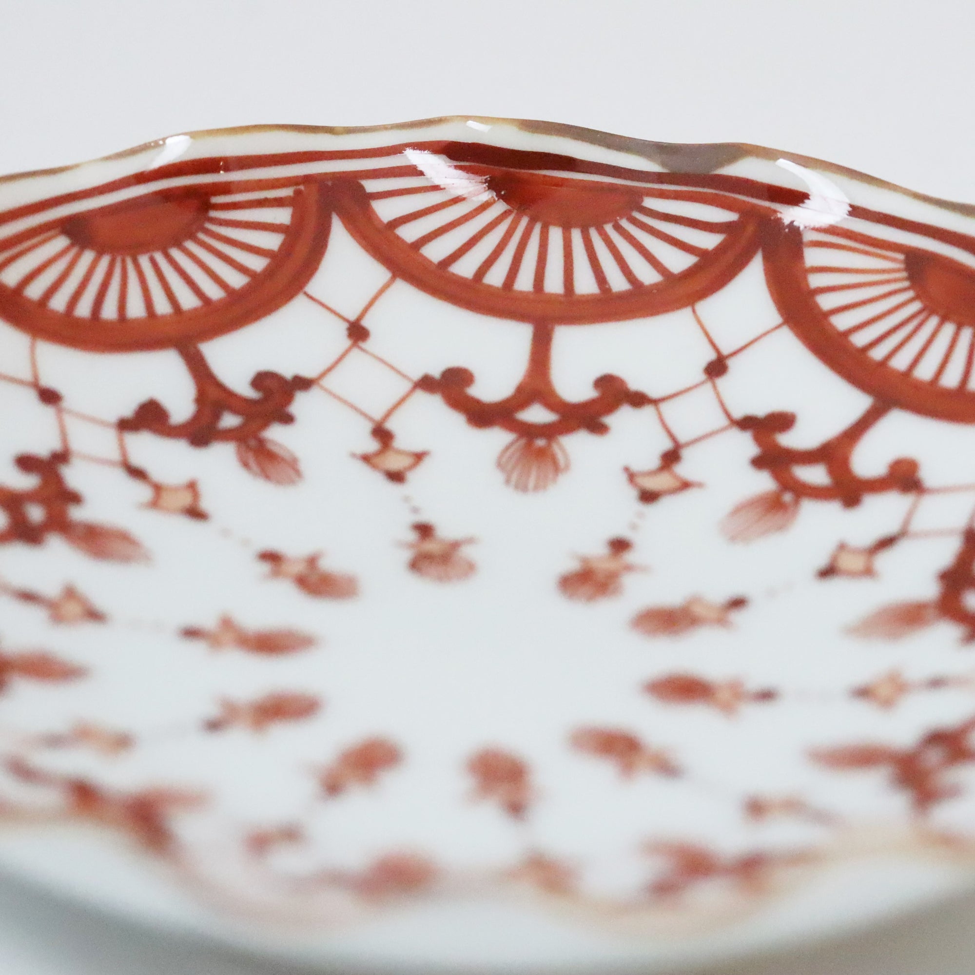 4-inch plate with brocade pattern and wave pattern