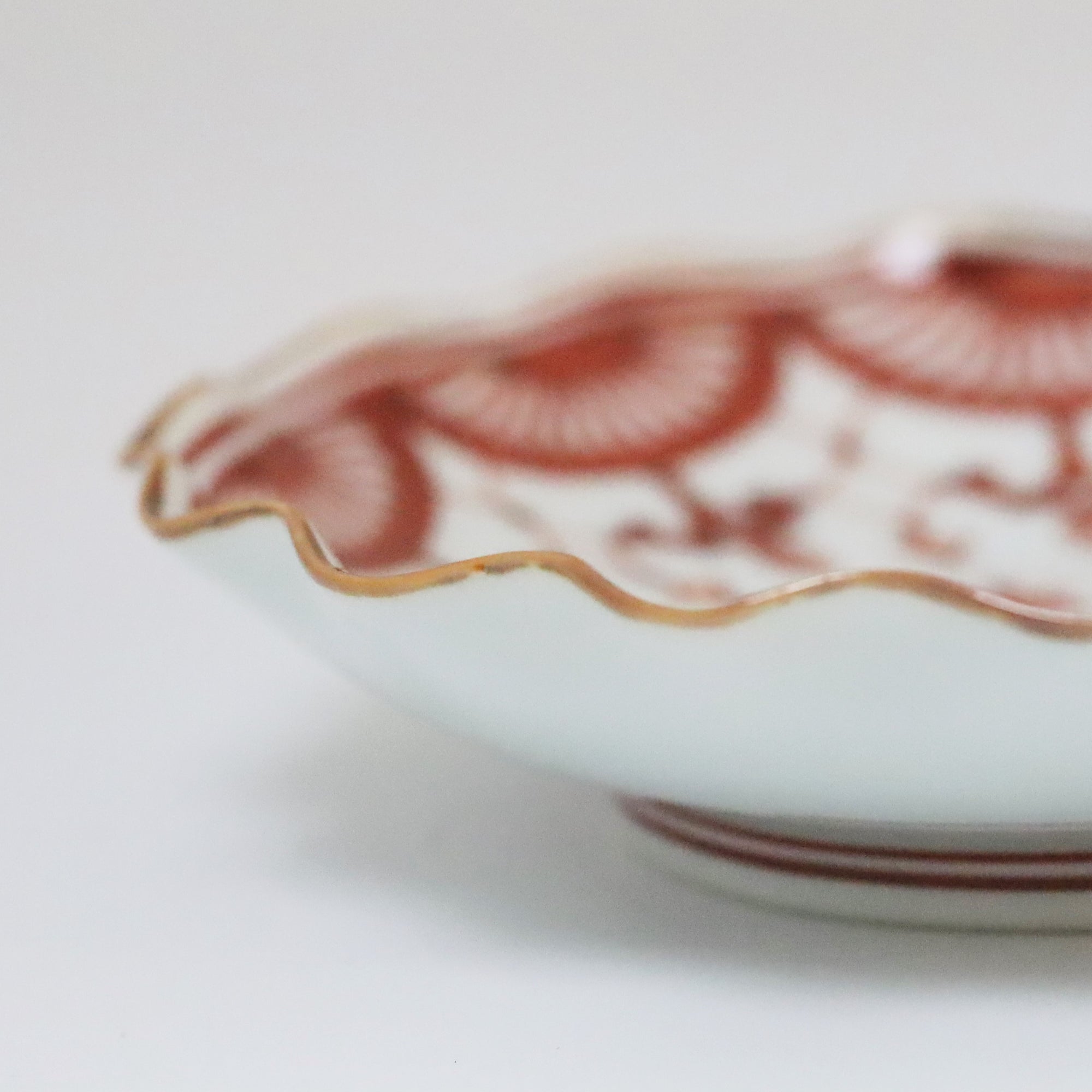 4-inch plate with brocade pattern and wave pattern