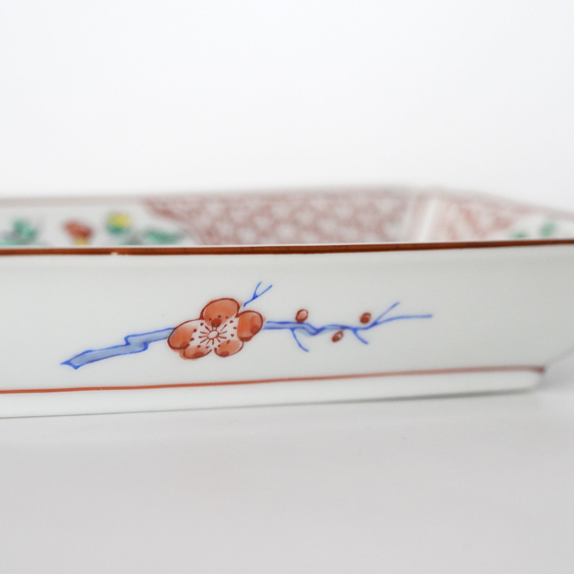 Long square plate with red plum blossoms and flowing water
