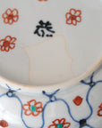 square flower patterned diamond-shaped plate