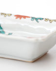 square flower patterned diamond-shaped plate