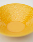 Brocade-yellow cross-toes with embossed crests