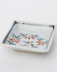 square flower patterned diamond-shaped plate