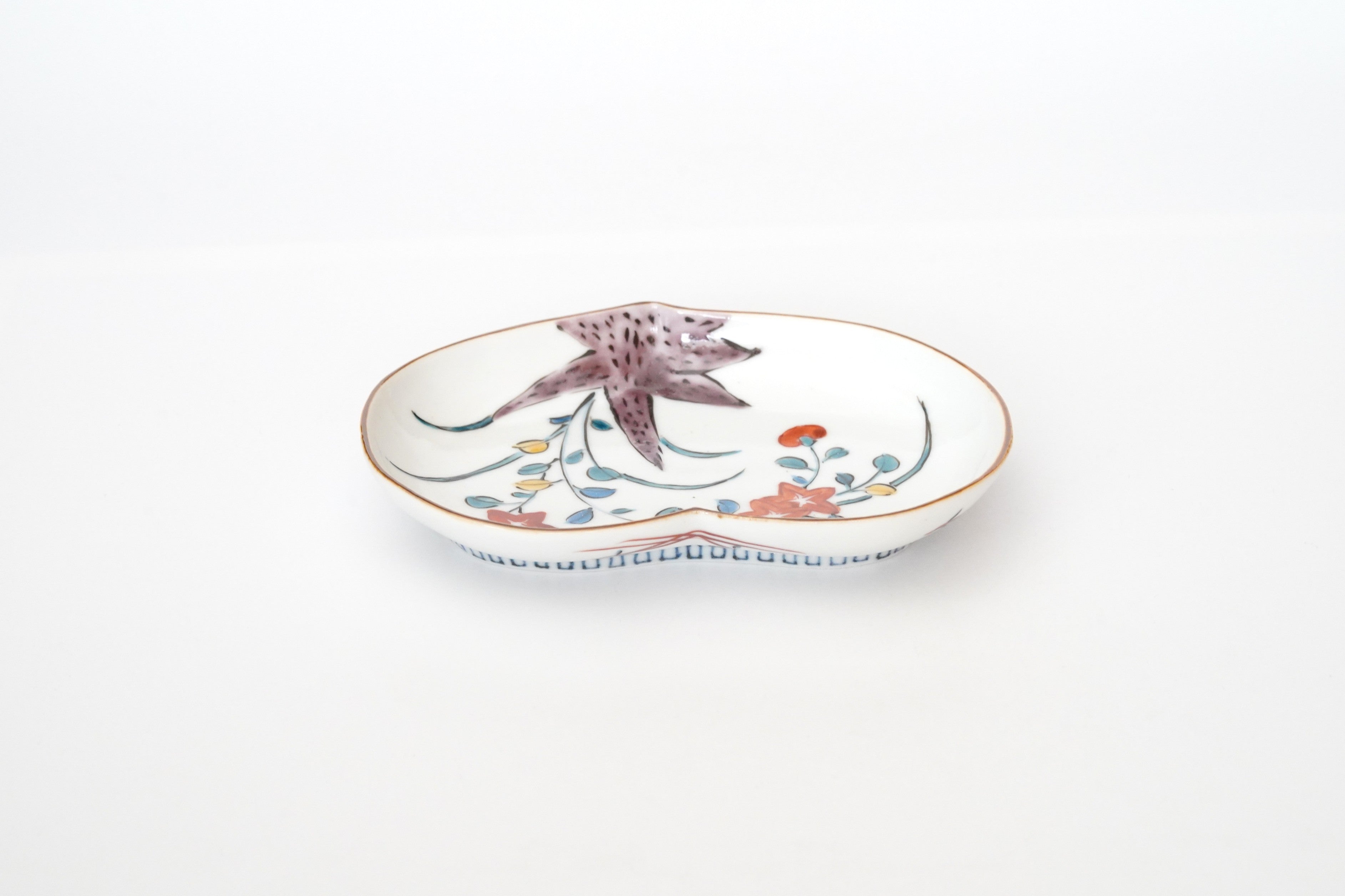 5-inch plate with ink-filled treasures and flowers and birds